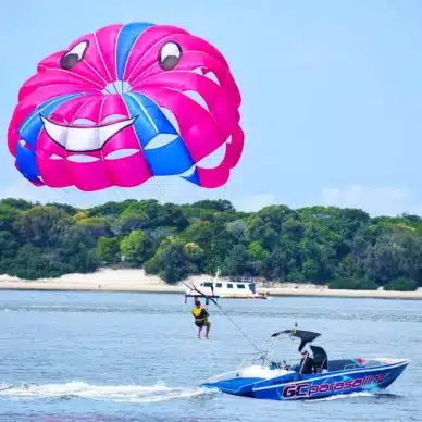 A Man Parasailing in Main Beach, QLD