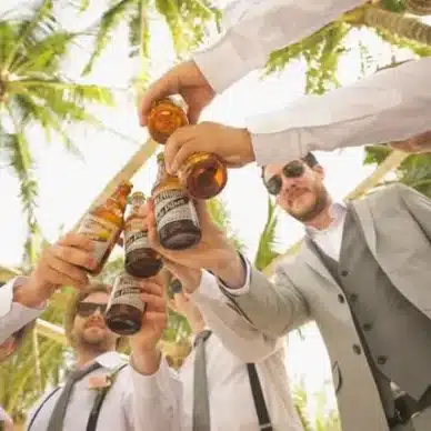 A Group Of Men Toasting Beer