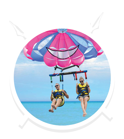 A Couple Do Tandem Parasailing in Main Beach, QLD