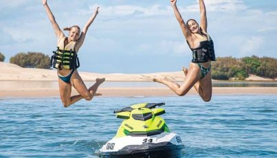 Mother and Teen Daughter Jumping — Jet Ski Hire and Tours in Main Beach, QLD