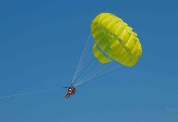 Two Person Doing A Parasailing Activity