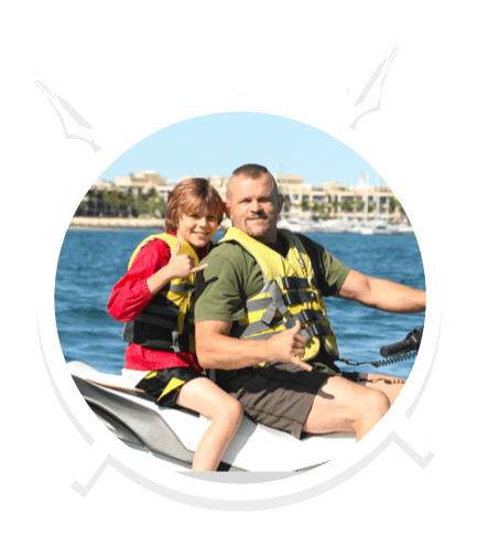 A Father and Son Giving a Rock Hand Sign while on Jet Ski in Main Beach, QLD