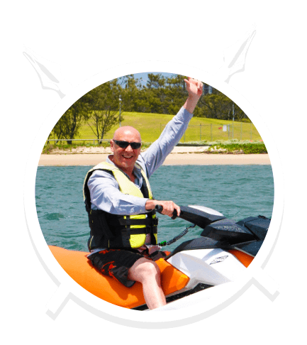 A Middle Aged Man with Shades Enjoying the Jet Ski in Main Beach, QLD