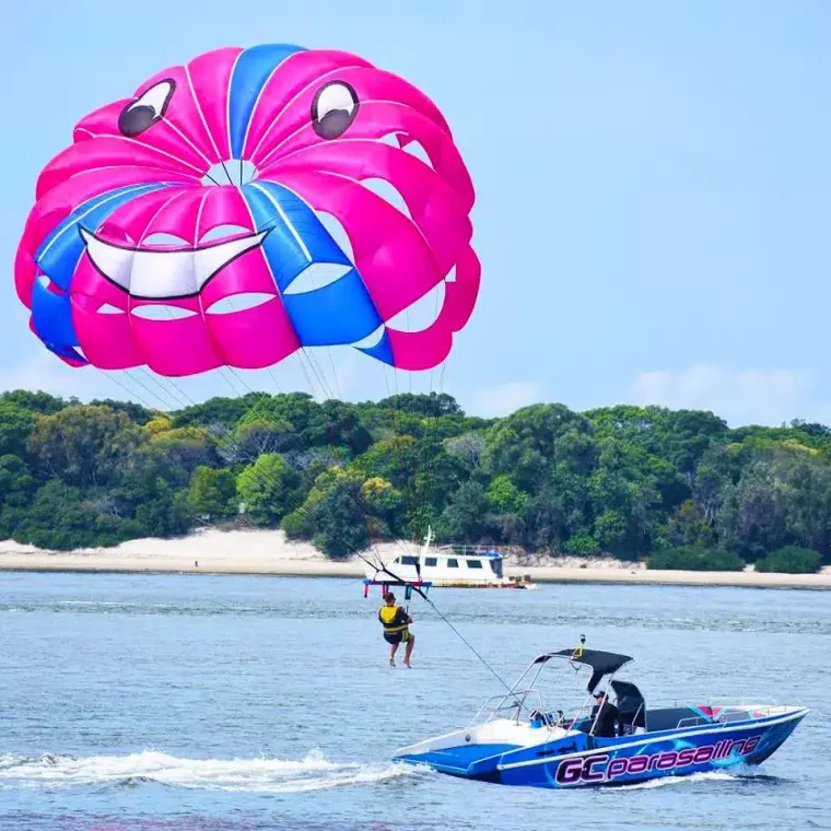 A Man Parasailing in Main Beach, QLD