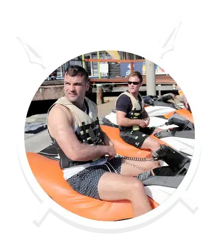 Two People is Ready to Drive their Orange Jet Ski in Main Beach, QLD